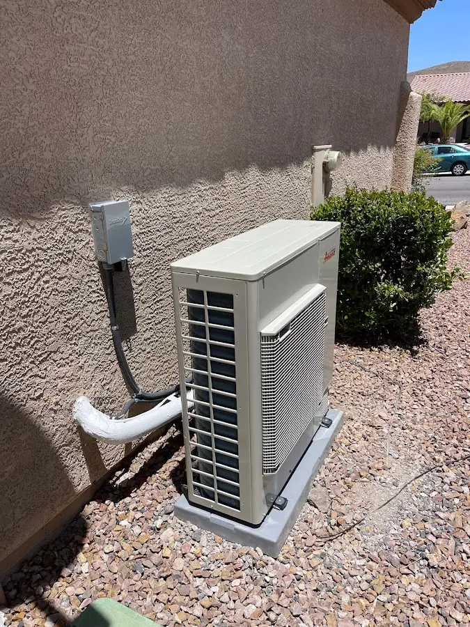 Residential air conditioning condenser unit in Byron